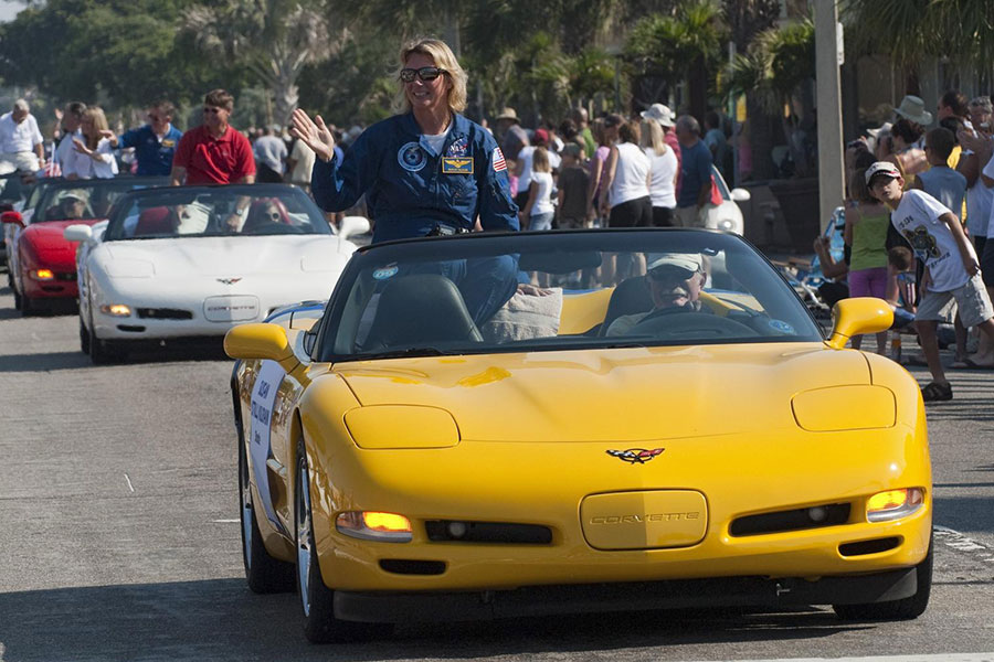 Retired space shuttle astronaut Susan Kilrain waves to spectators from a Chevrolet Corvette during a commemorative parade in Cocoa Beach, Fla.  