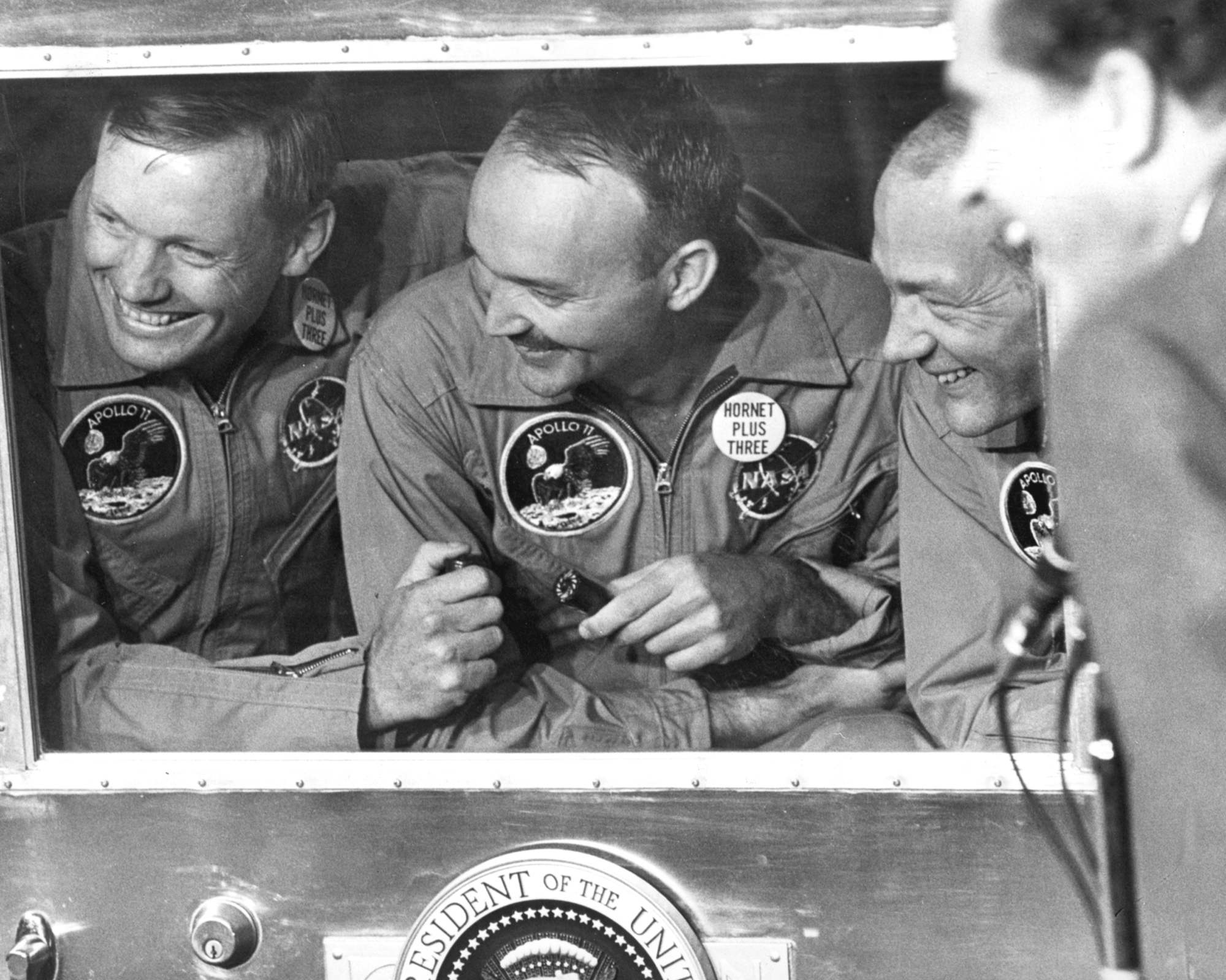 Apollo 11 laughing through quarantine window