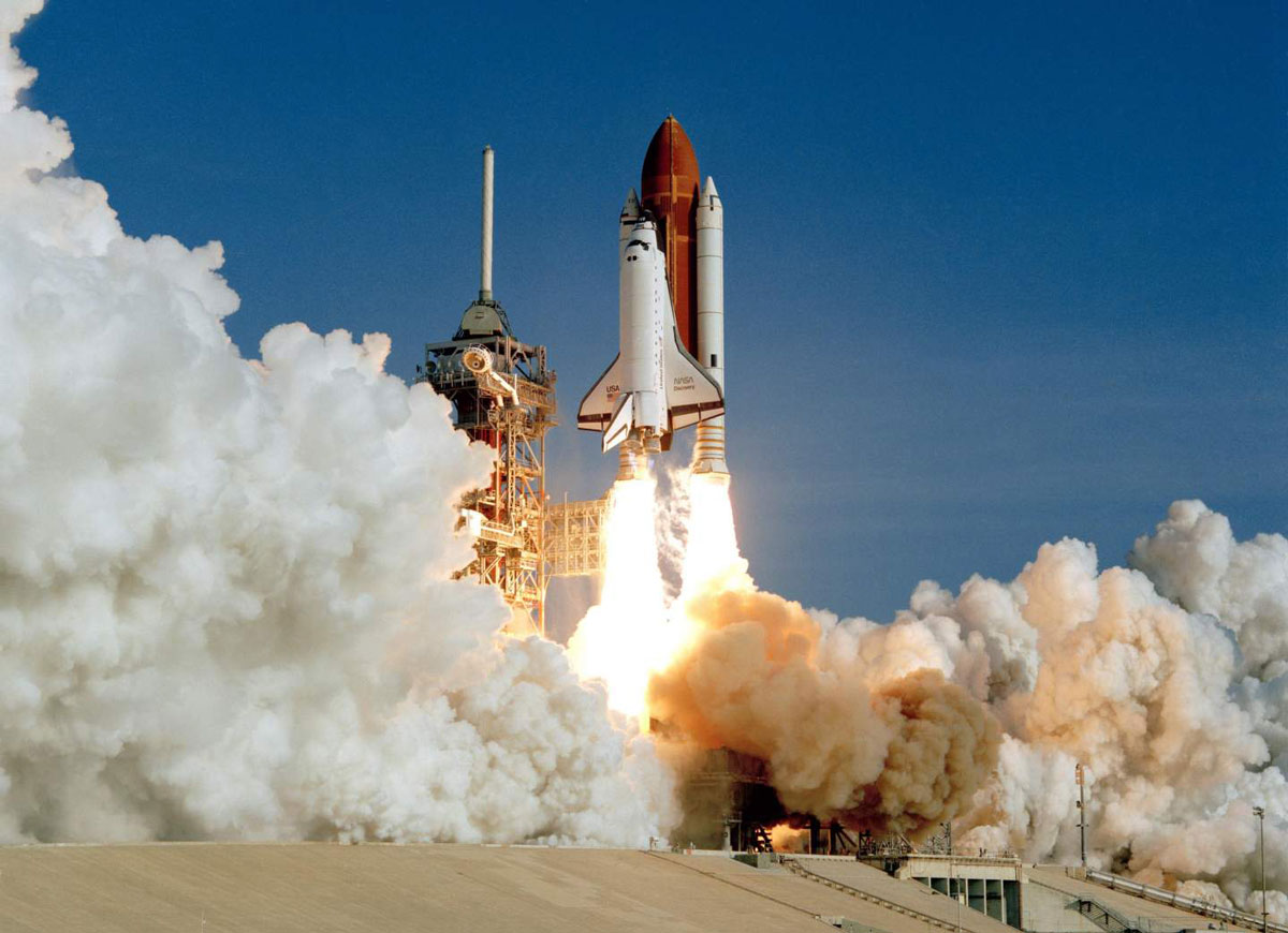 Space shuttle Discovery launches from Launch Pad 39A at Kennedy Space Center for its maiden voyage on August 30, 1984.