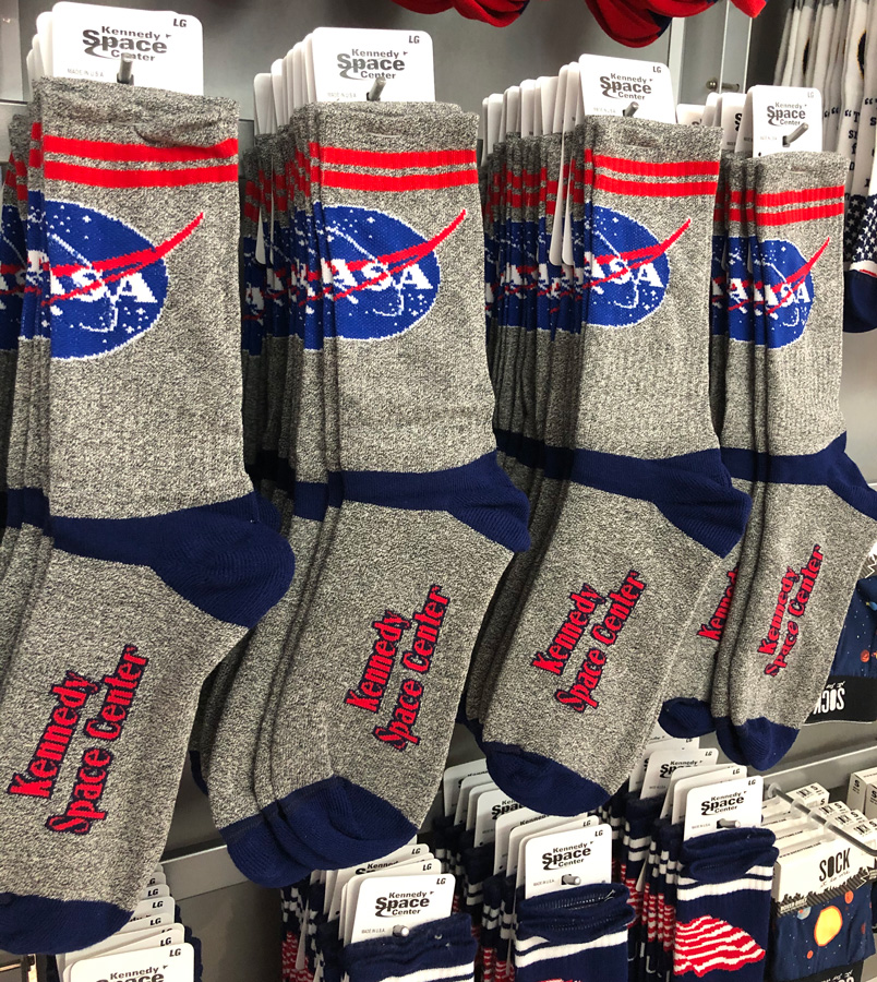 Socks with the NASA logo and Kennedy Space Center on it.