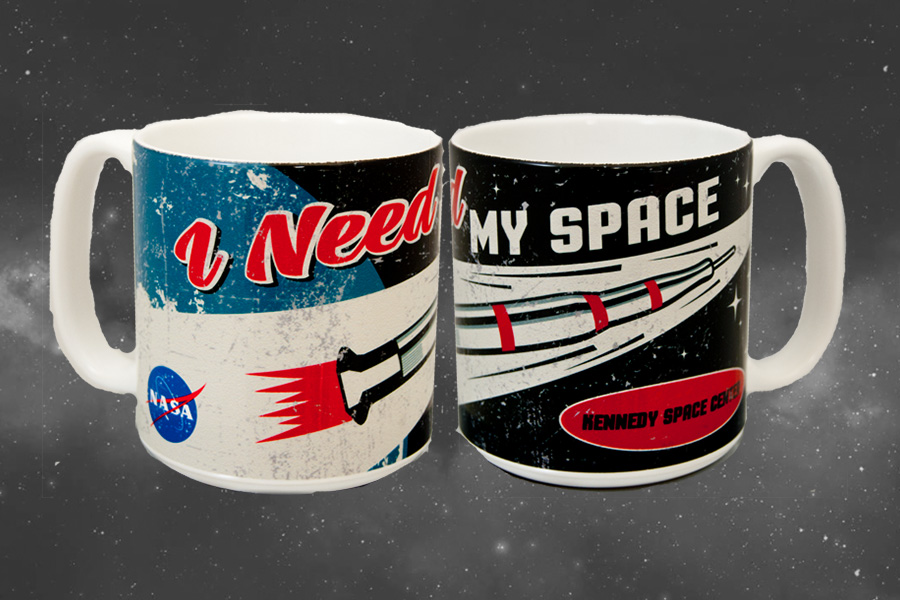Ceramic mug with a retro style Saturn V rocket and the quote 'I need my space' printed on it.