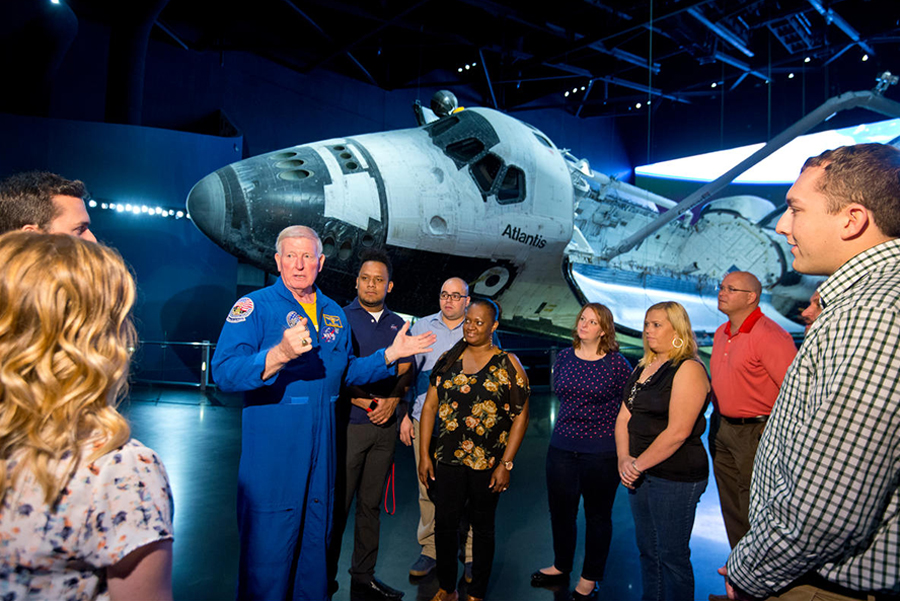 Guests touring Space Shuttle Atlantis with Astronaut Jon McBride during Fly With An Astronaut.