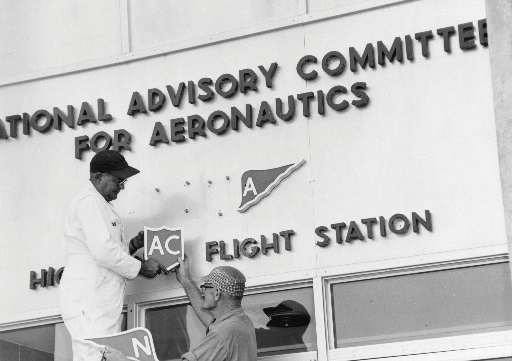 NACA sign being altered to NASA in 1958