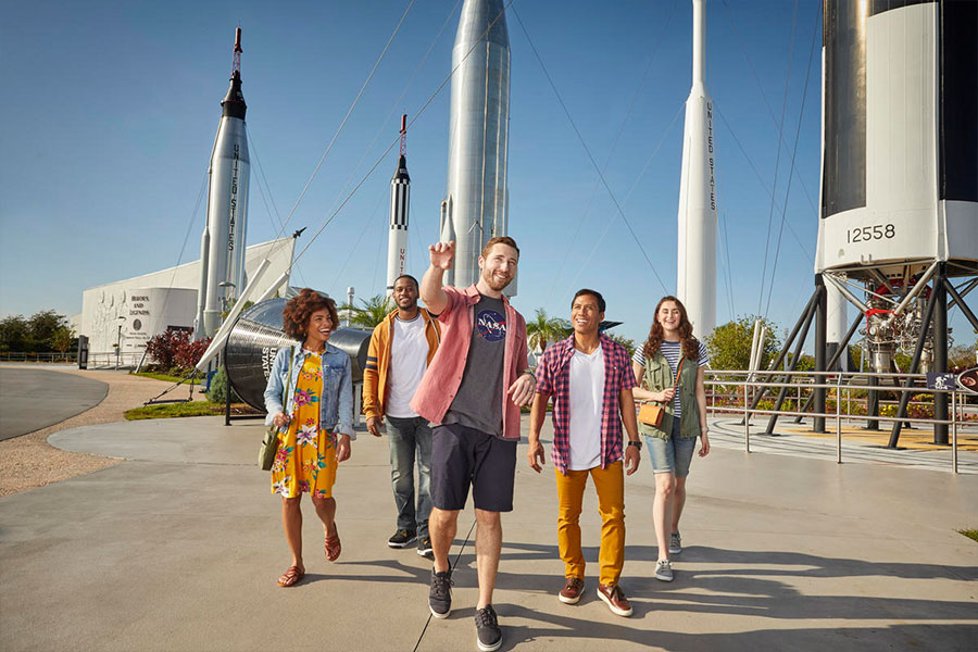 A group walks through and admires the Rocket Garden at Kennedy Space Center Visitor Complex.