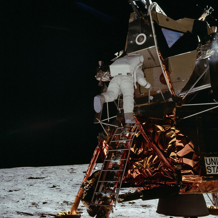 Astronaut Edwin E. Aldrin Jr., lunar module pilot for the Apollo program, egresses the Lunar Module (LM) 'Eagle' and begins to descend the steps of the LM ladder as he prepares to walk on the moon.
