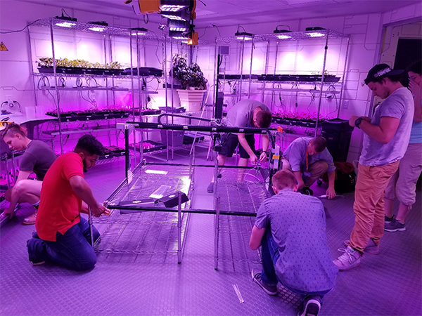 The Florida Institute of Technology project team assembling the FarmBot.